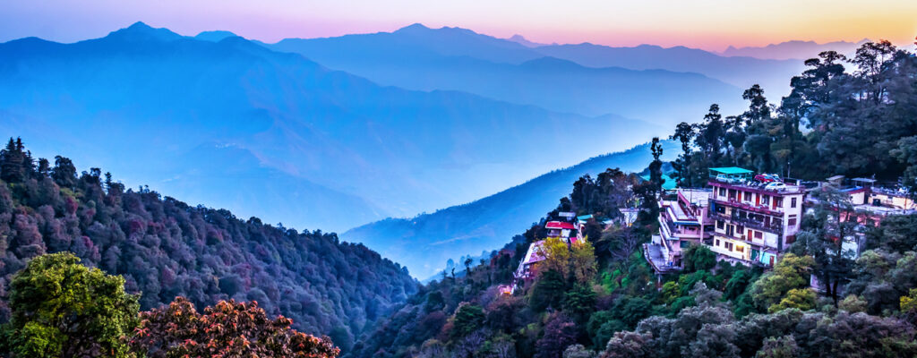 View of Mussoorie from above showcasing lush forests and mountains