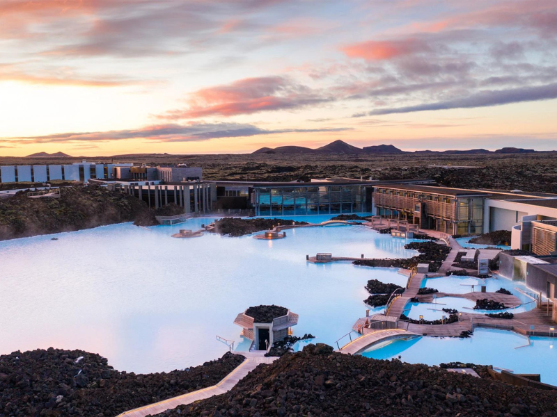 The famous Blue Lagoon hot spring with milky blue water and volcanic rocks