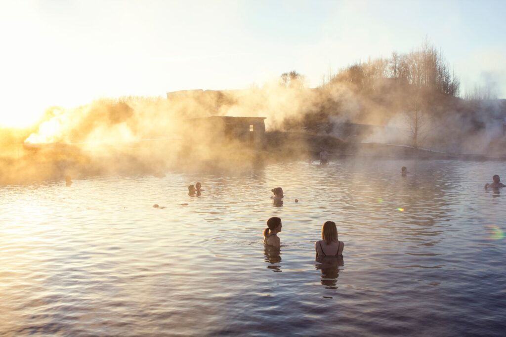 People relaxing in a geothermal hot spring in Iceland